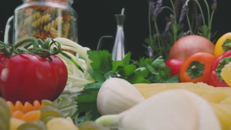 uncooked dried pasta and fresh vegetables