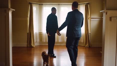 man buys house and shakes hands with the realtor.