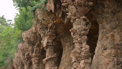 Birds-Nests-In-The-Terrace-Walls-Resembles-The-Pine-Trees-In-Park-Guell,-Spain