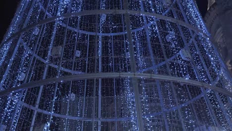 glittering lights of giant christmas tree made of led lights in vigo, galicia, spain