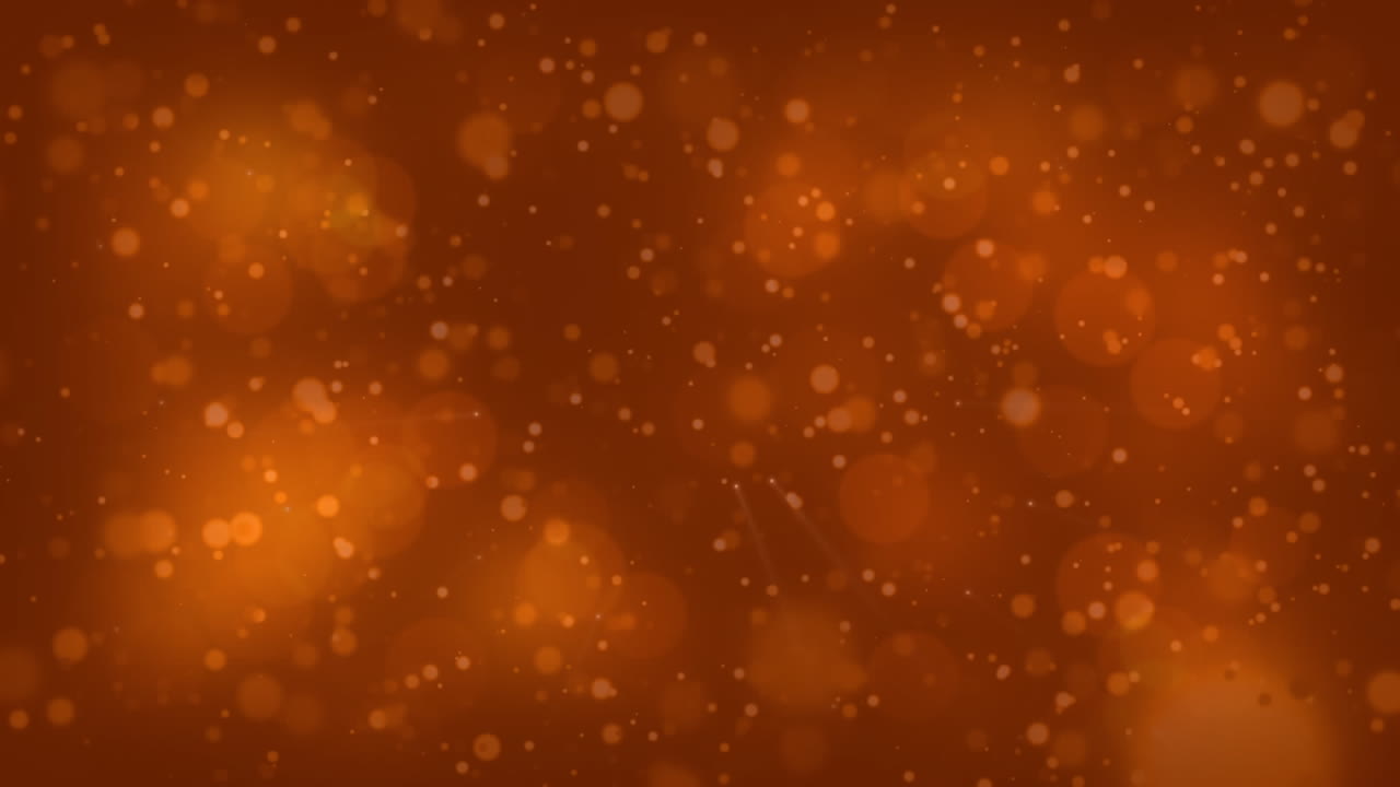 video generado digitalmente de puntos brillantes que se mueven contra un fondo naranja