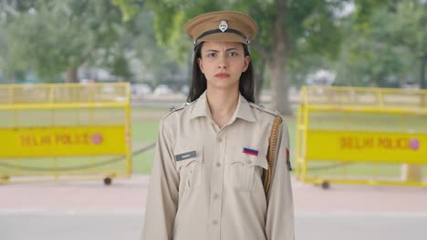 angry indian female police officer staring