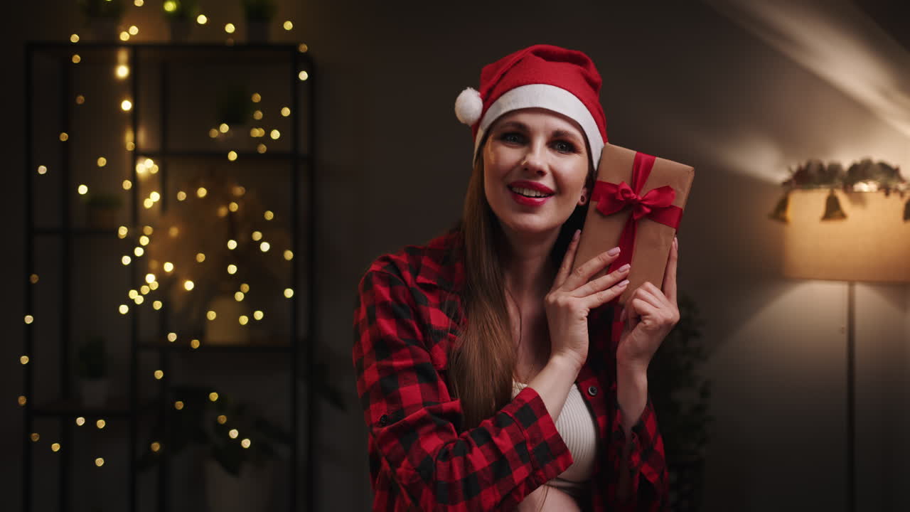 Pregnant woman with christmas gift