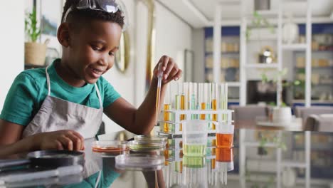 Video-of-happy-african-american-boy-doing-experiments-at-home