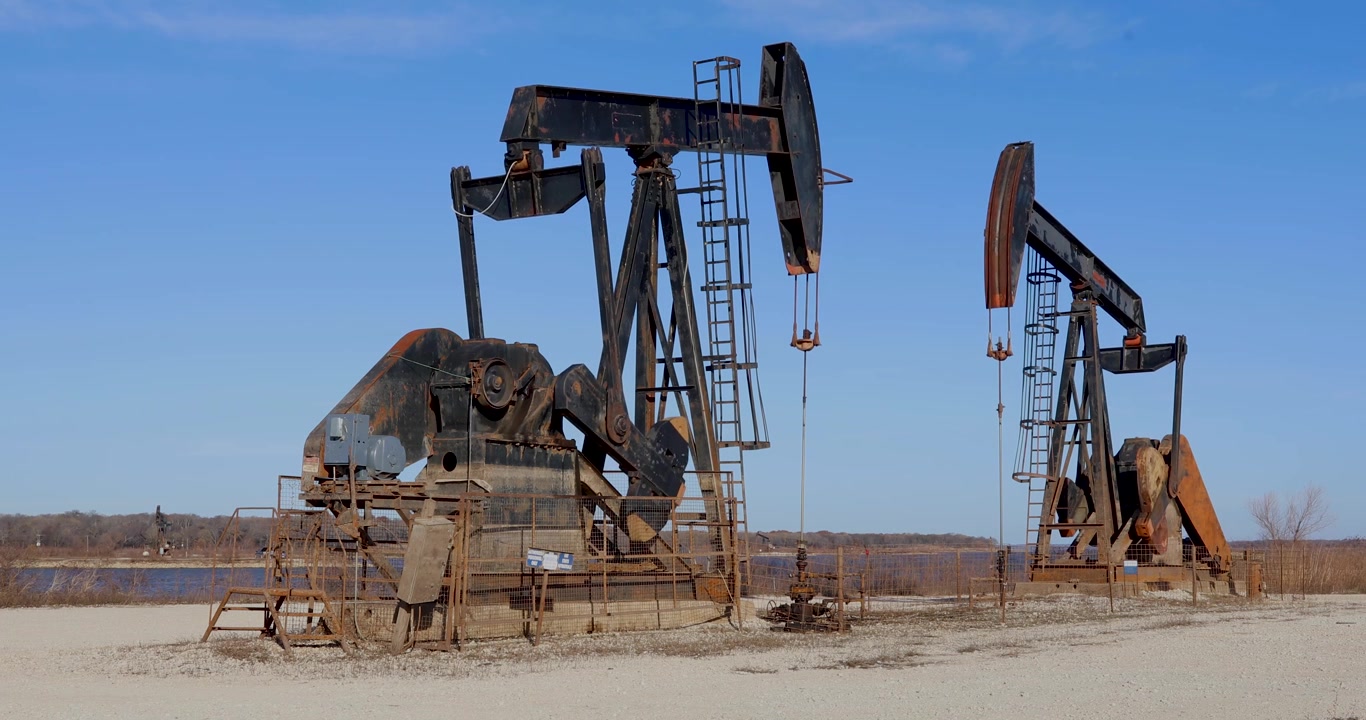 Static video of working oil derricks in the Hagerman National Wildlife Refuge in Sherman, Texas