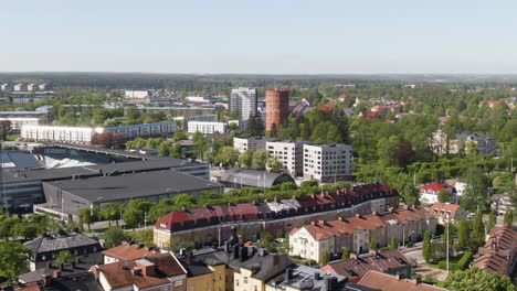 high altitude drone view of norrkoping living district with green trees