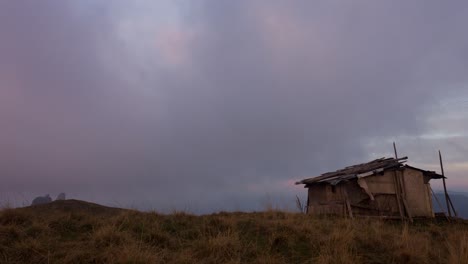 timelapse of a deserted hut on a mountain top