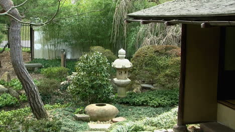 pan across japanese tea garden to a traditional japanese tea house