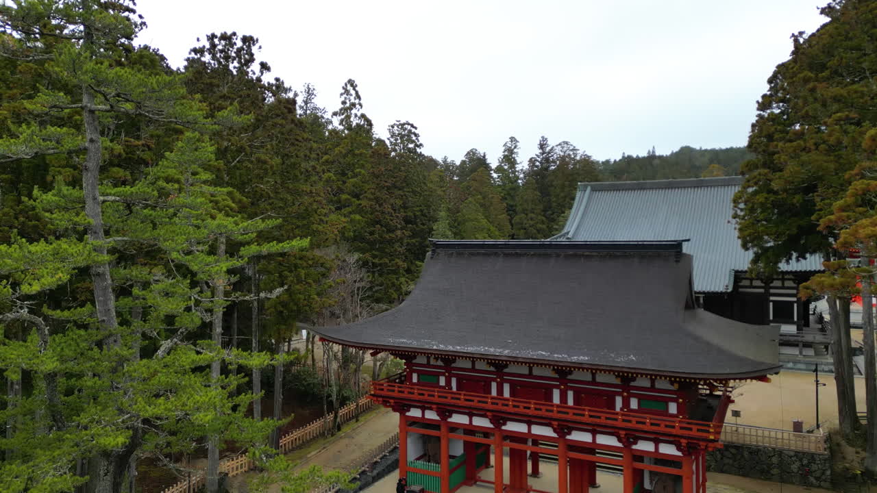 Aerial view rising in front of the Koyasan temple, cloudy day in Koya, Japan