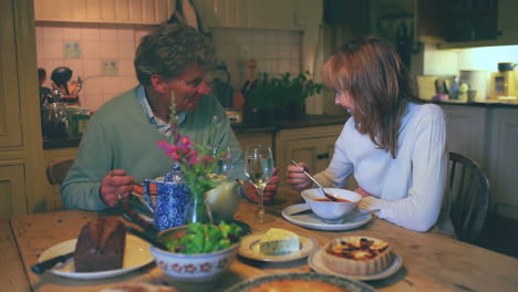 Mature-couple-having-dinner-together