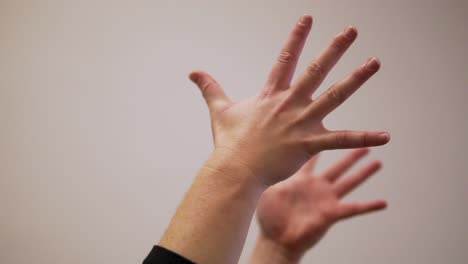 female's hands doing yoga