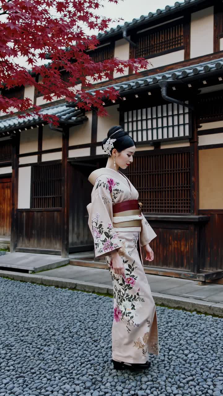 A video still of a woman in a kimono walking in a traditional Japanese street