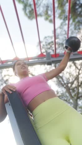 woman exercising at an outdoor fitness park