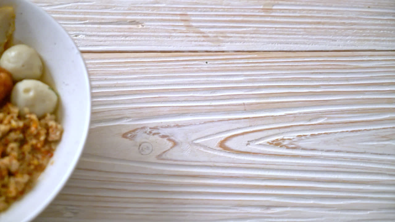 spicy noodles with fish ball and minced pork (Tom Yum Noodles) - Asian food style