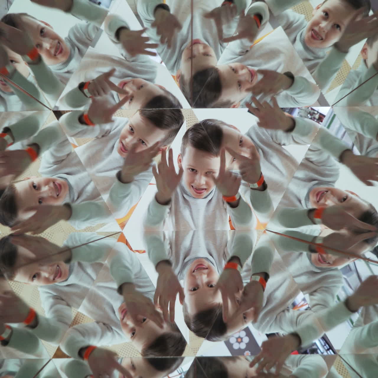 Child in a kaleidoscope tunnel. Glance into infinity Square video