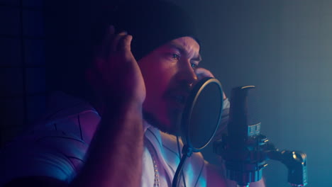 man recording music in a studio