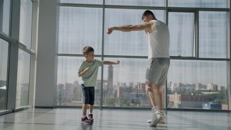father and son boxing training session