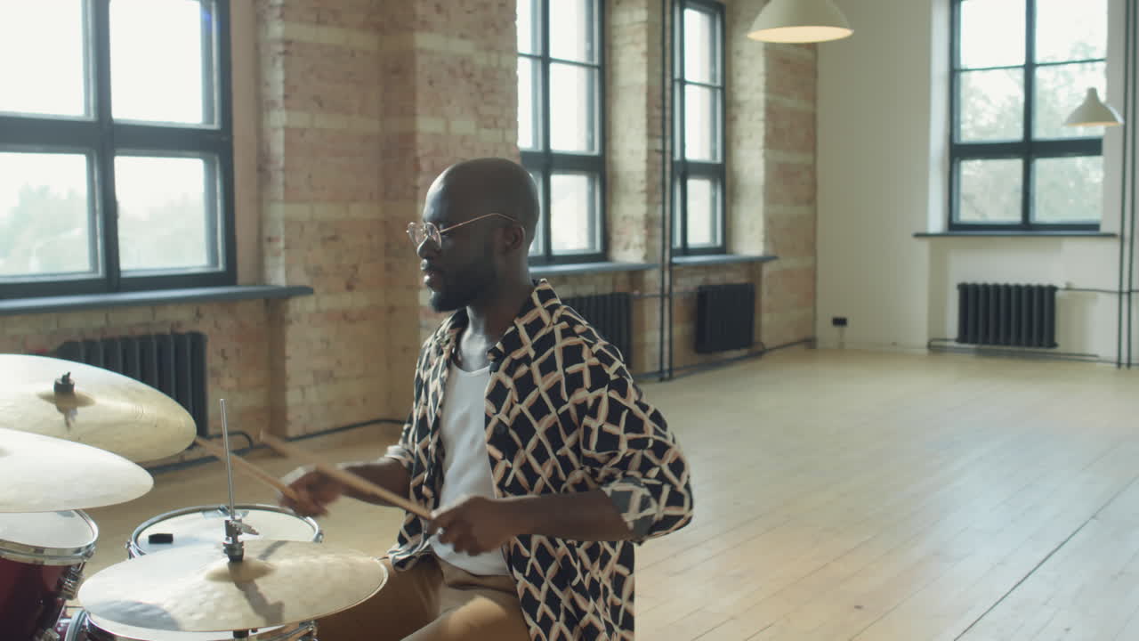 African American Drummer Talking on Camera and Playing Drums