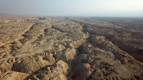 aerial footage over soft sedimentary rock desert wadi israel