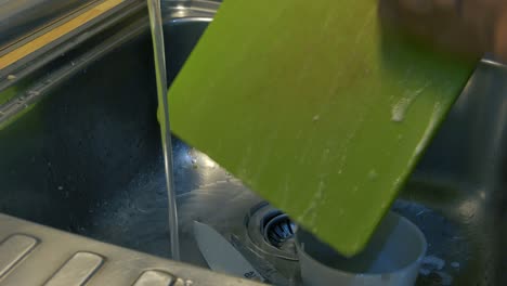 Scrubbing-some-pots-in-a-sink