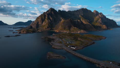 green mountains and calm blue arctic ocean in pristine summer light. lofoten, norway nature aerial.