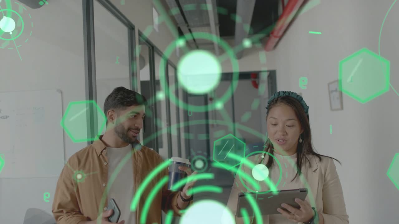 Man showing phone while walking glass hall woman tapping tablet HUD overlaying pair, checking biz