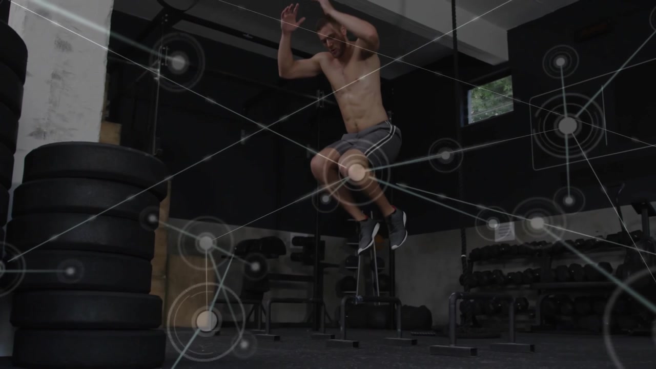 Athletic Man Performing Box Jumps in a Gym