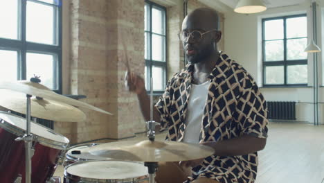 african american man giving online drum lesson