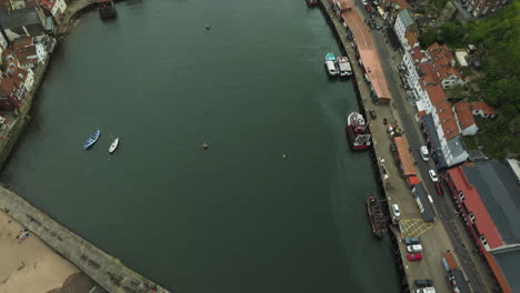 Aerial-view-of-the-River-Esk-and-Whitby-town,-a-great-break-in-sailing-journey