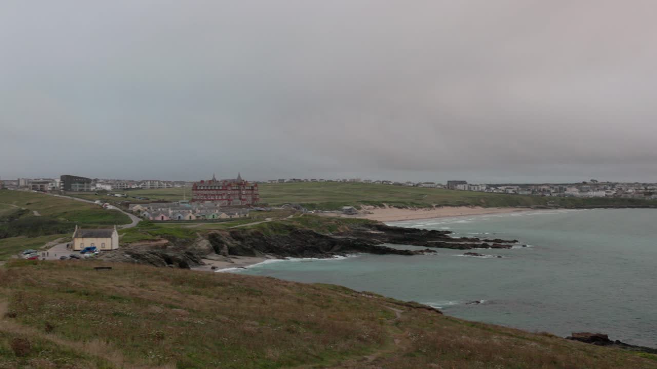 Panning shot of the Newquay harbour and Fistral beach scenery