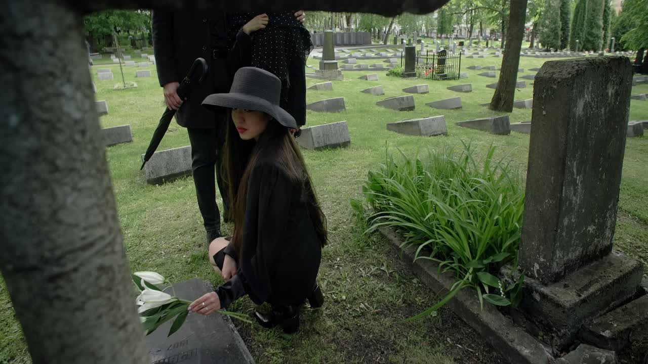 Woman Visiting a Grave