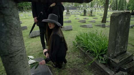 woman visiting a grave