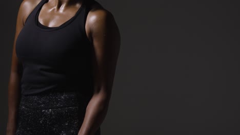 Close-Up-Studio-Shot-Of-Mature-Woman-Wearing-Gym-Fitness-Clothing-Exercising-With-Resistance-Band-2