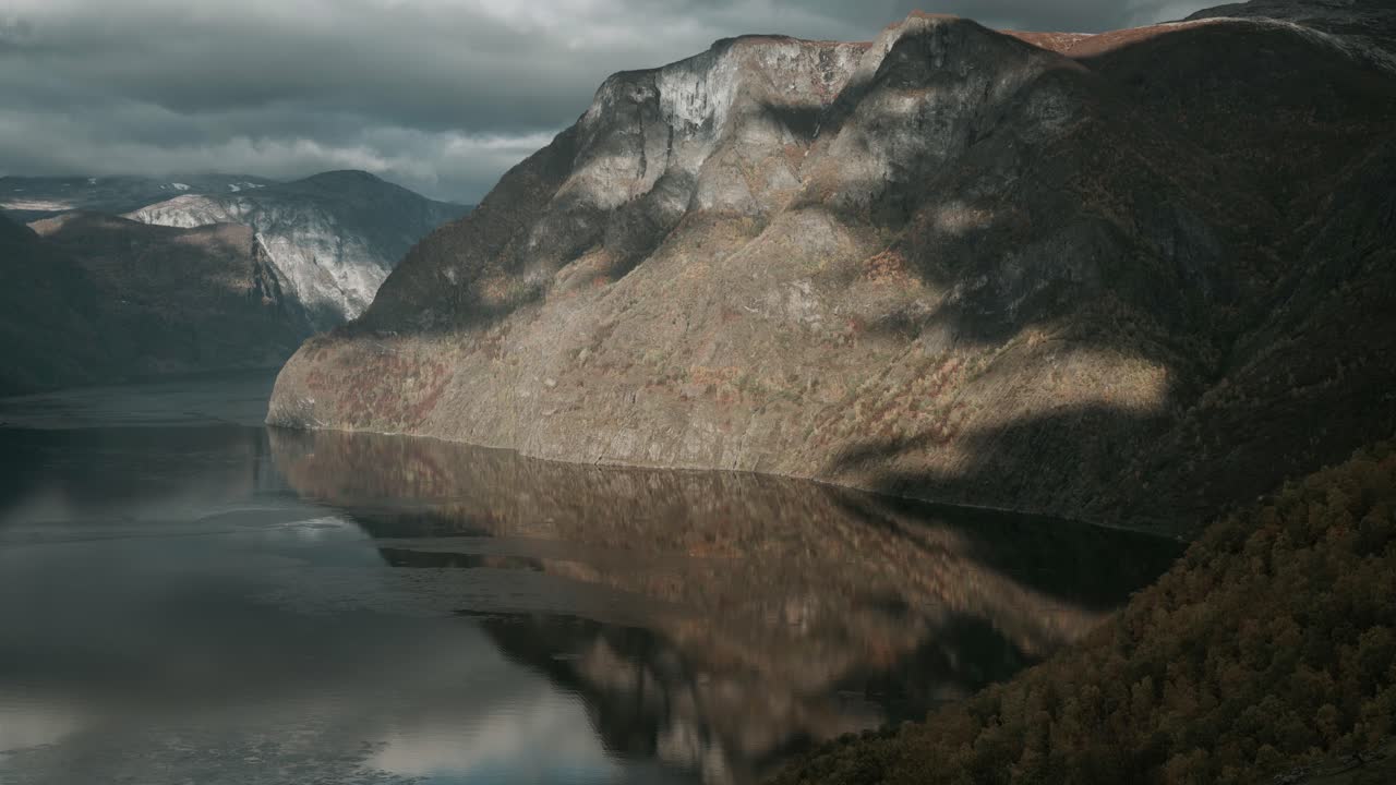 Shadows of clouds moving over Aurland fjord in Norway