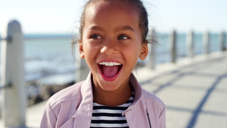 Child,-face-and-surprised-girl-by-beach