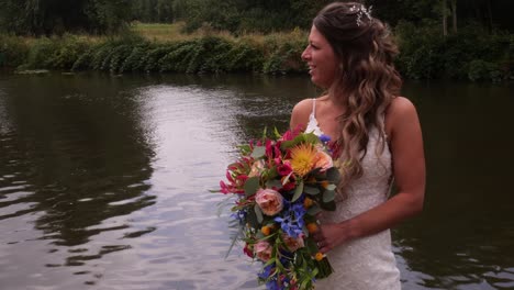 Beautiful-Bride-Posing-Near-The-Lake-At-Sunset---medium-shot