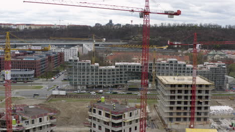 Tower cranes at construction site with office buildings in Prague city