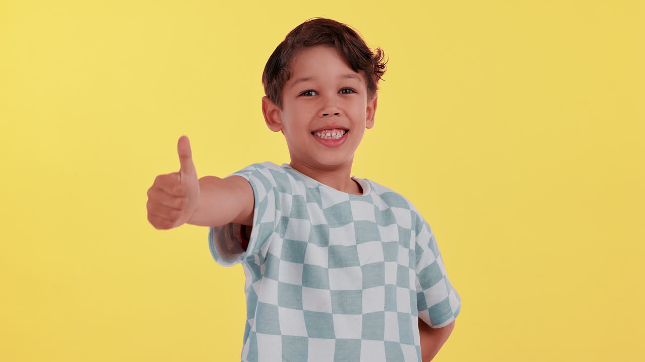 Happy boy giving a thumbs up