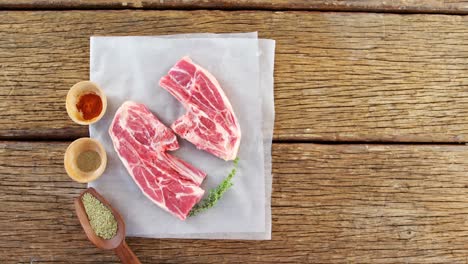 sirloin steak and ingredients on wooden background