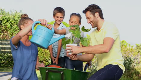 happy young family gardening together