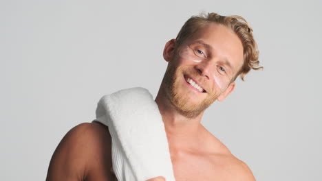 man putting towel over his shoulder