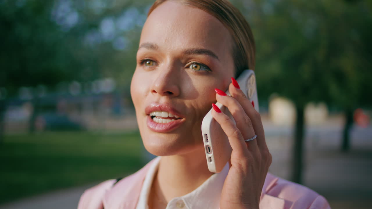 Business manager consulting smartphone standing outdoors close up. Woman calling