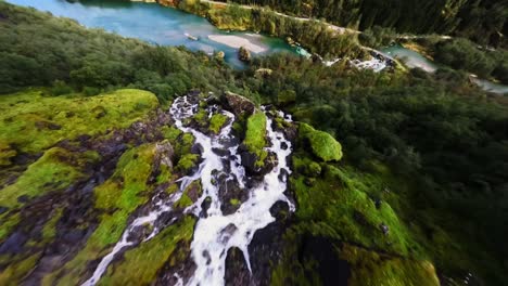 waterfall dive in norway surrounded by incredible landscape (fpv footage)