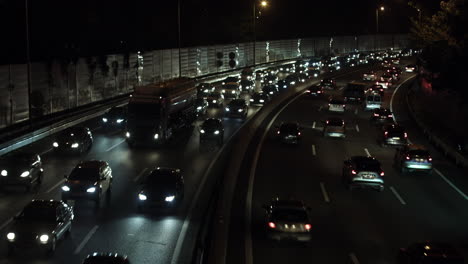 cars in traffic jam at the street at night