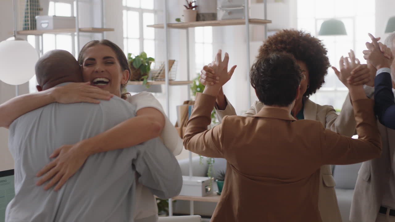 happy business people celebrating successful corporate victory colleagues hugging in office meeting enjoying winning teamwork success