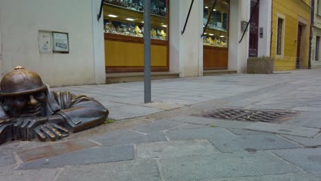 cumil, the "man at work" in bratislava, slovakia brings good luck to those who touch his hat