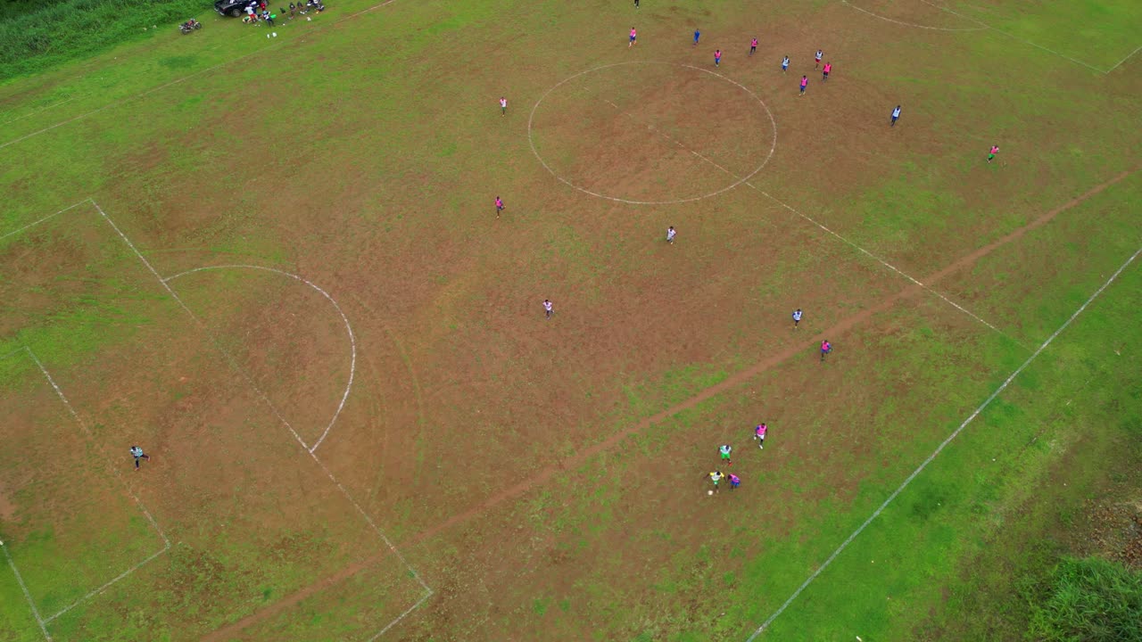 Bird's eye view of a football field with men playing with the ball at Trindade,São Tomé,Africa