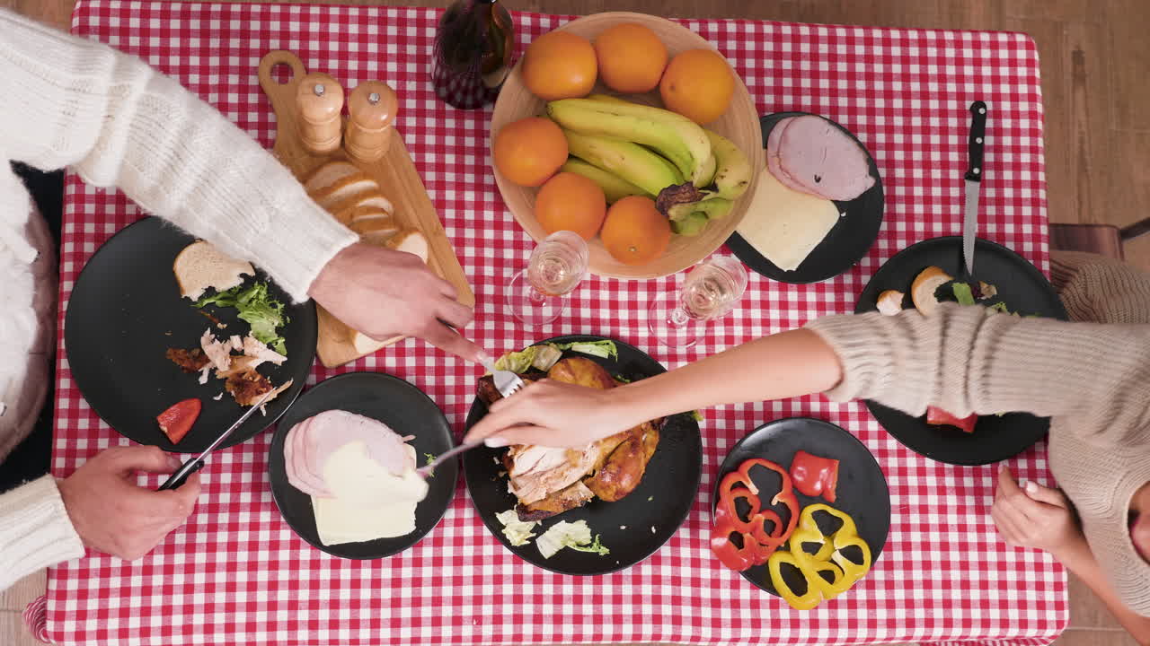 Overhead Shot of Family Meal with Chicken, Fruit, and Salad