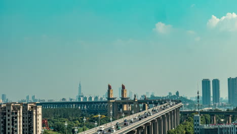 Sunrise-time-lapse-Nanjing-city-famous-international-youth-cultural-center-River-Bridge-traffic-flow-rush-hour-near-skyline-skyscraper-high-landmark-buildings