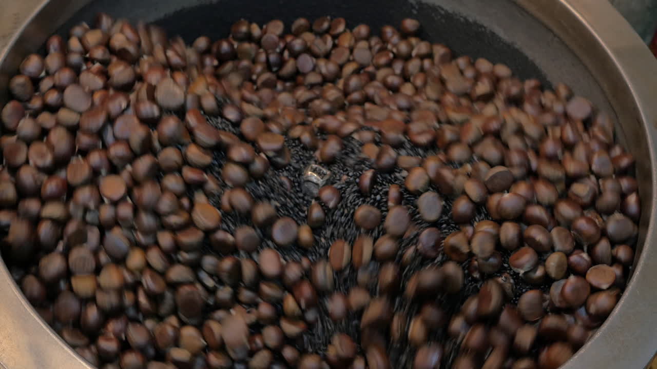 Roasting chestnuts in the street of Bangkok Thailand